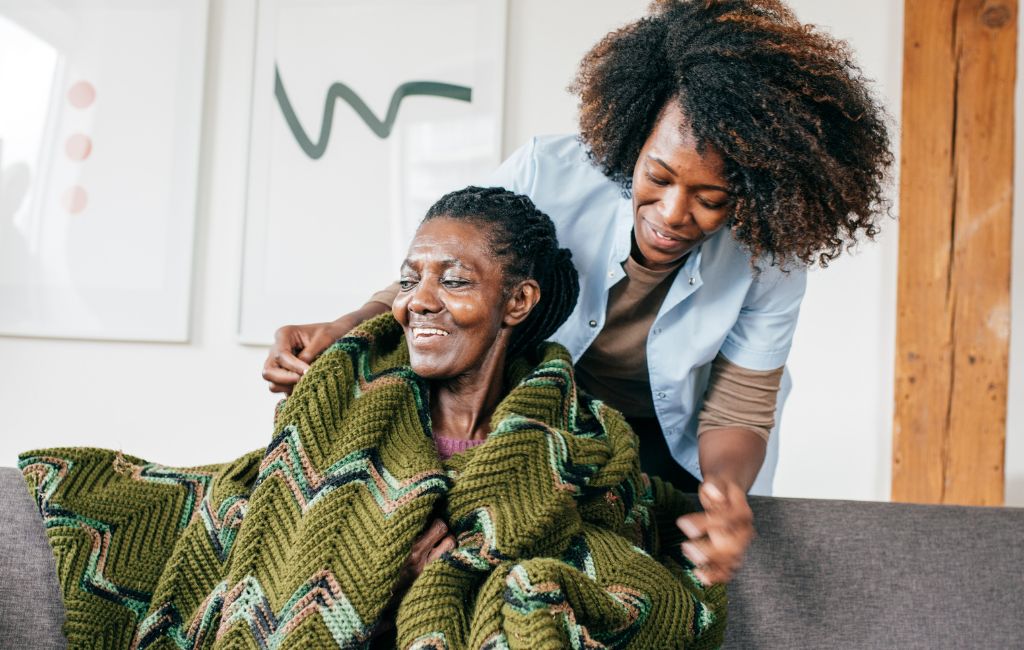 caregiver giving a sweater