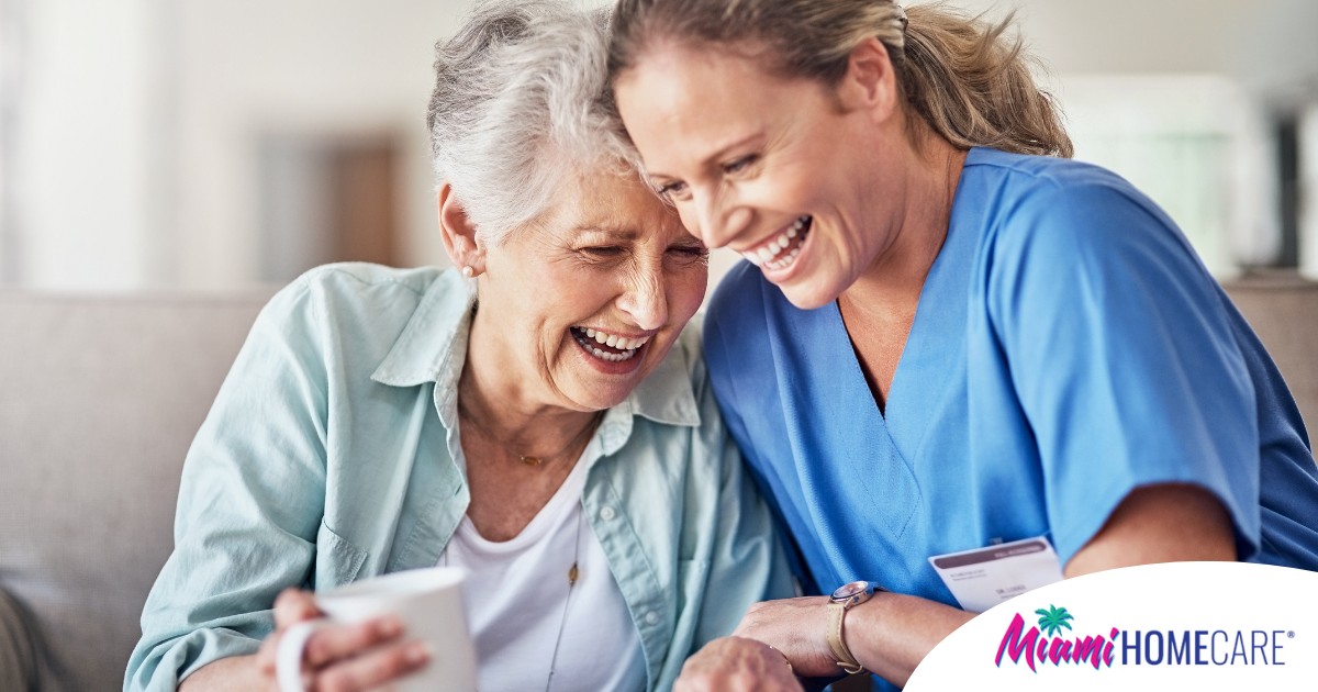 A woman in scrubs laughs with a senior woman, representing how caregiving can be a great career choice.