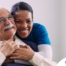 a graphic showing What a Week of Elder Care at Home Really Looks Like with a smiling caregiver and client